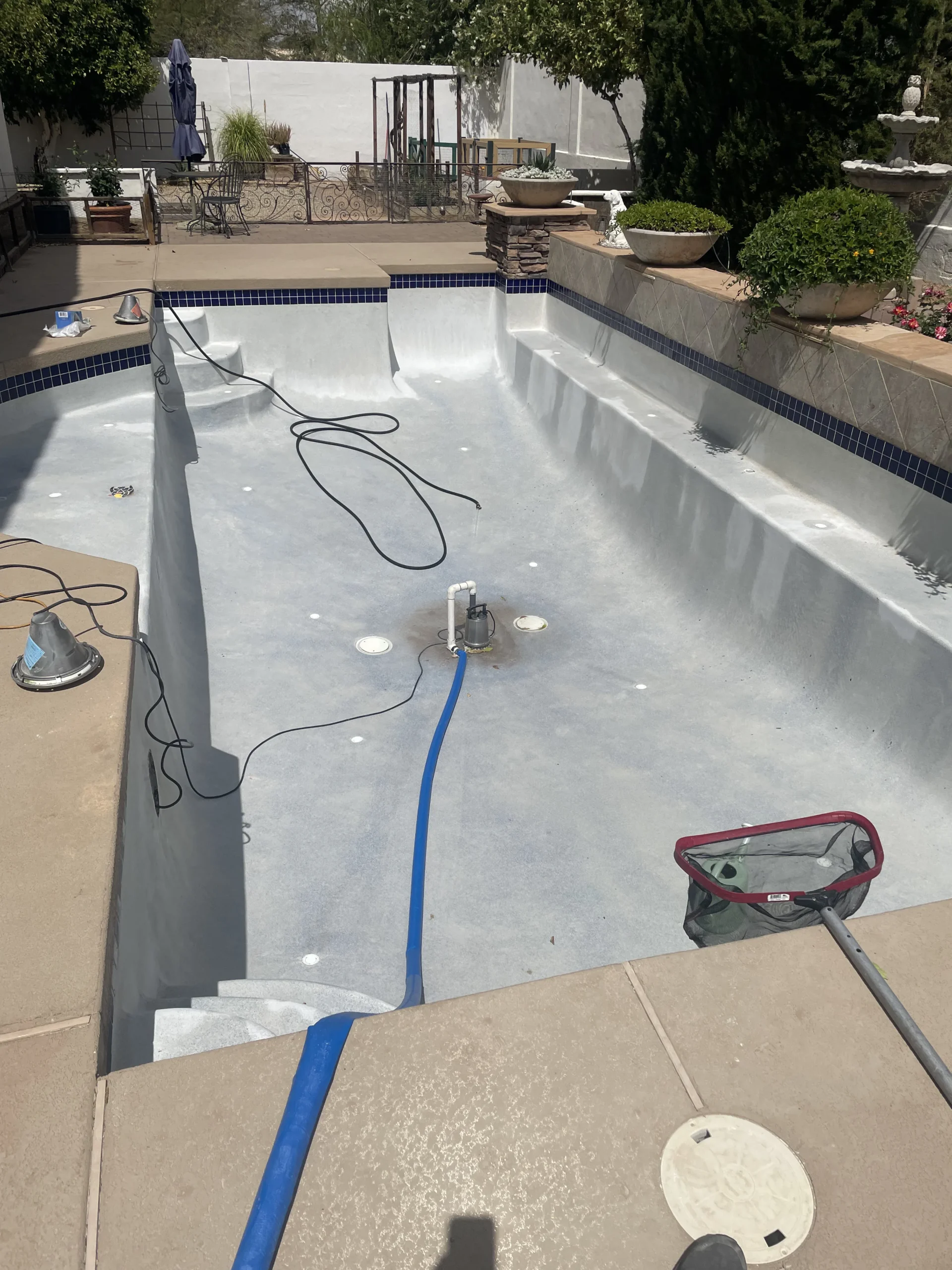 Professional team from Iconic Pools & Spas remodeling a pool, showcasing craftsmanship and quality service